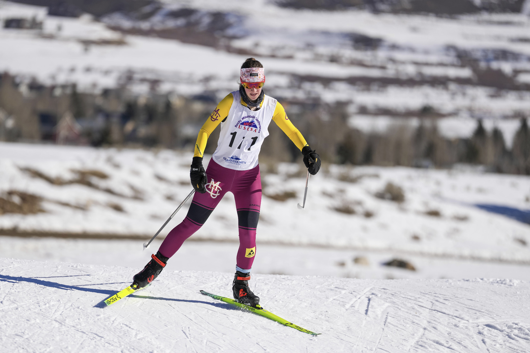 CMU athlete racing on a groomed cross country ski trail