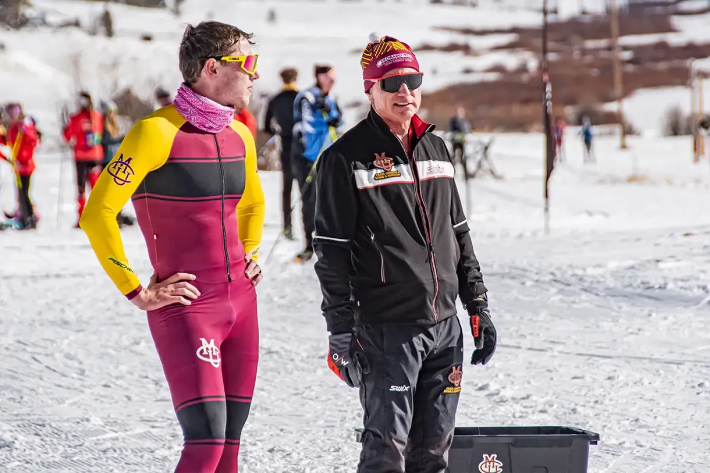 CMU's Nordic coach with an athlete after the ski race